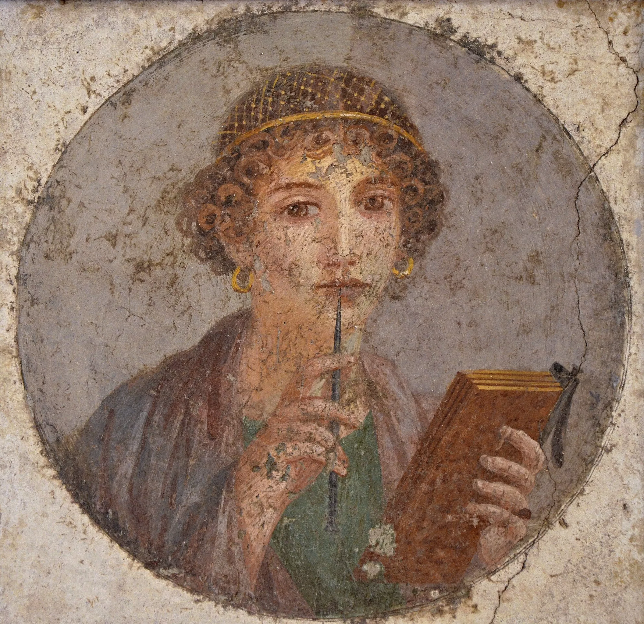 Fresc de Pompeia que mostra a una dona subjectant elements d'escriptura: una tableta de cera i un estilet