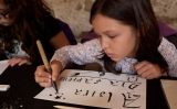 Taller infantil d'escriptura medieval